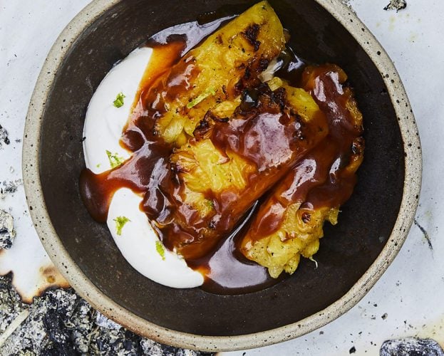 Barbecued pineapple with spiced rum burnt caramel and lime cream