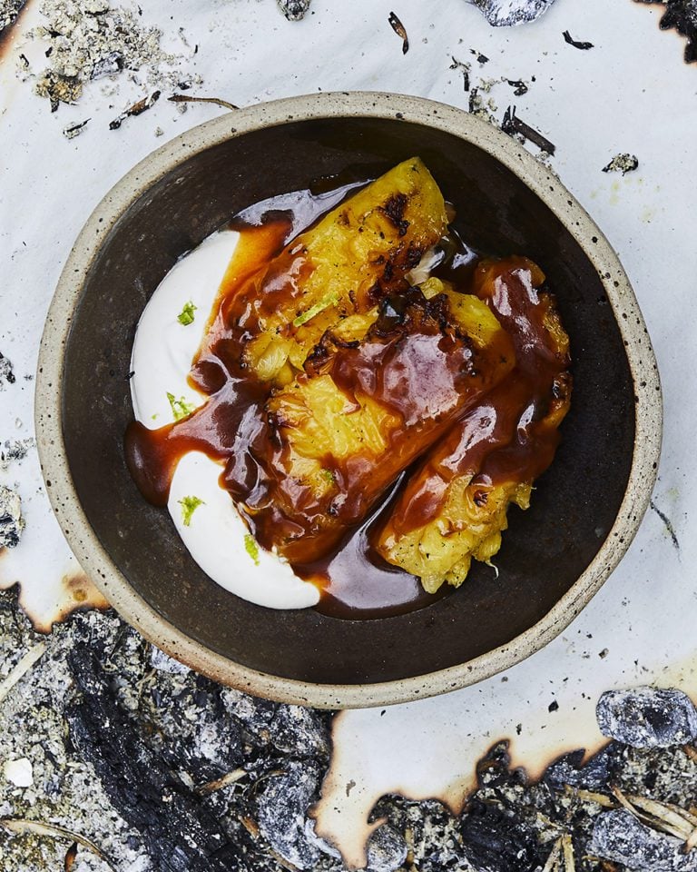 Barbecued pineapple with spiced rum burnt caramel and lime cream