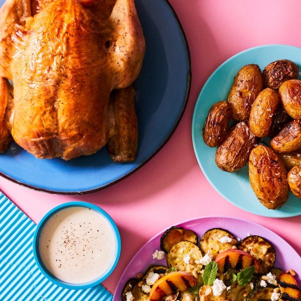 Summer roast chicken with holiday potatoes and courgette and peach salad