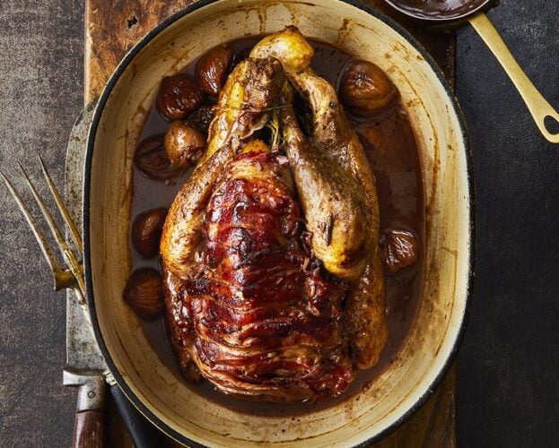 Pot-roast guinea fowl with chestnuts and spiced gravy
