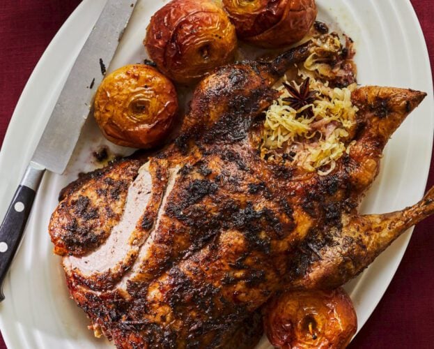 Sauerkraut-stuffed duck with roast apples and mulled wine gravy