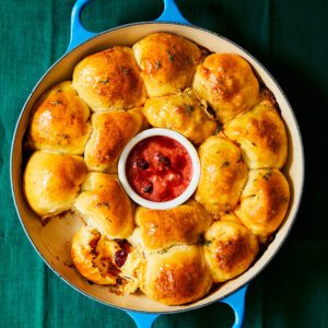 A dough ball wreath with cranberry and 'nduja in the centre