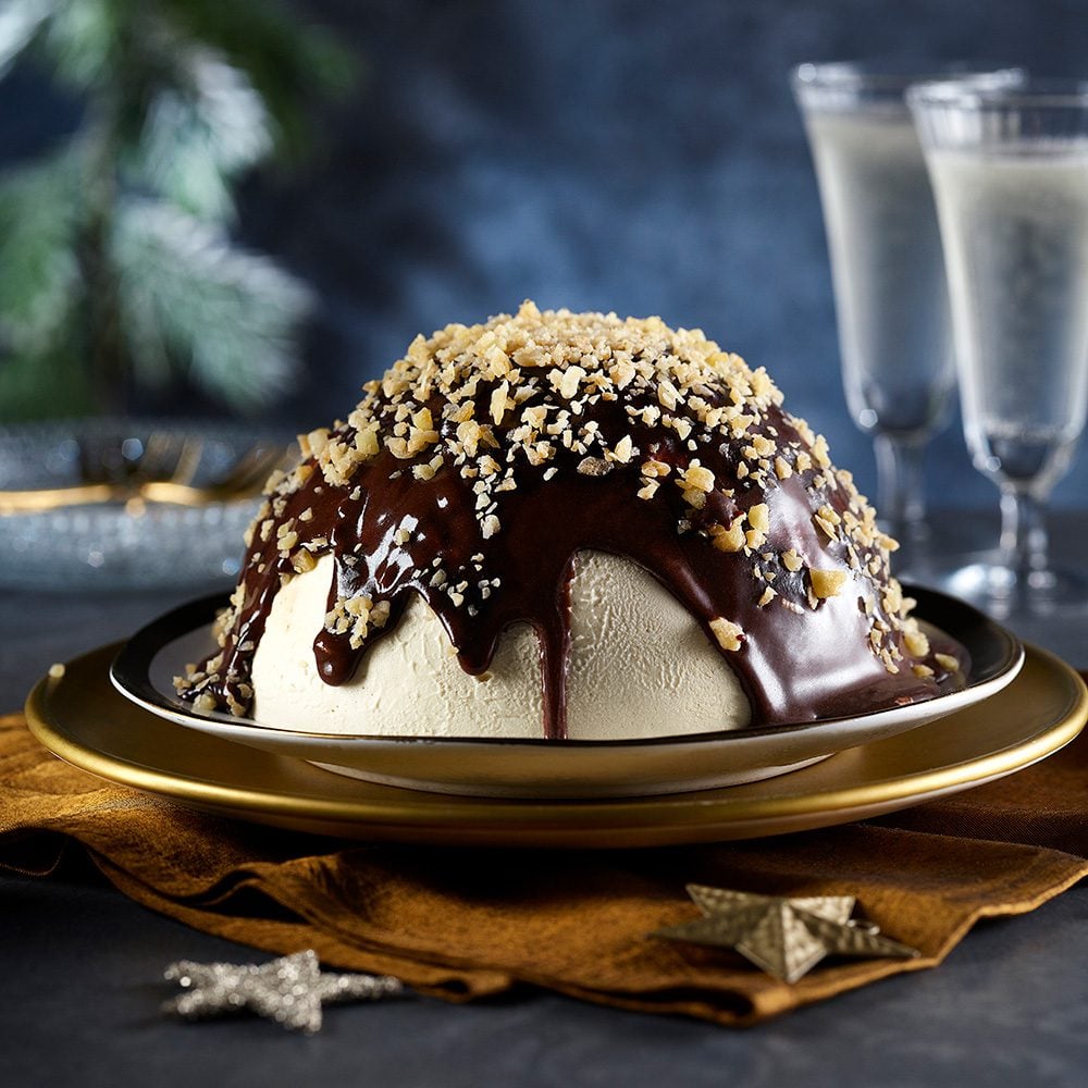 A dome of semifreddo topped with chocolate sauce