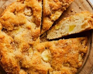 A overhead view of an apple cake, with two slices cut