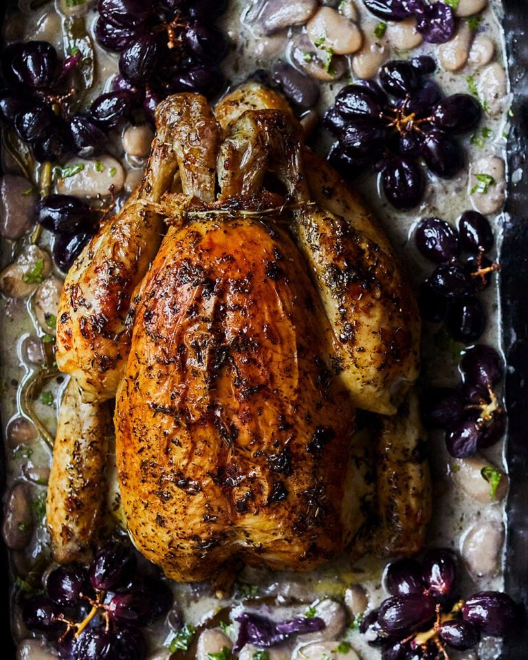 Roast chicken with vermouth, beans and grapes
