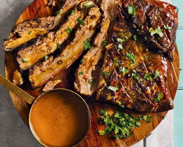 Sliced garlic pork belly (vinidaloush) on board