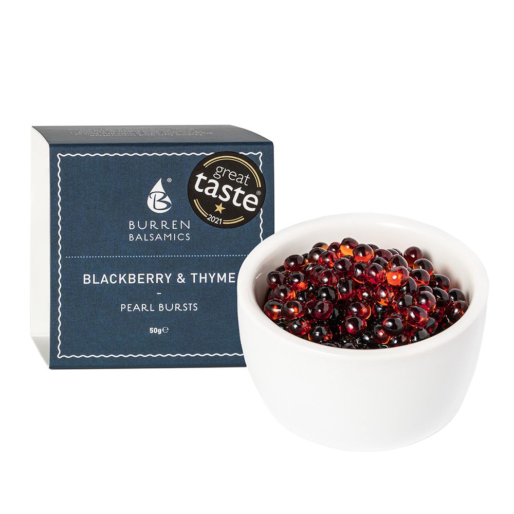 A bowl of Burren Balsamics pearls with packaging in the background