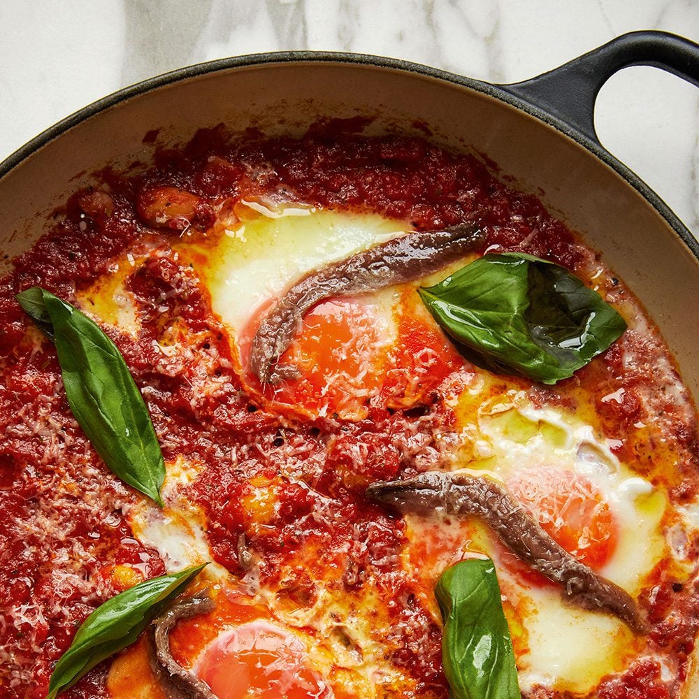 Image of pizza baked eggs from cookbook Good Eggs by Ed Smith