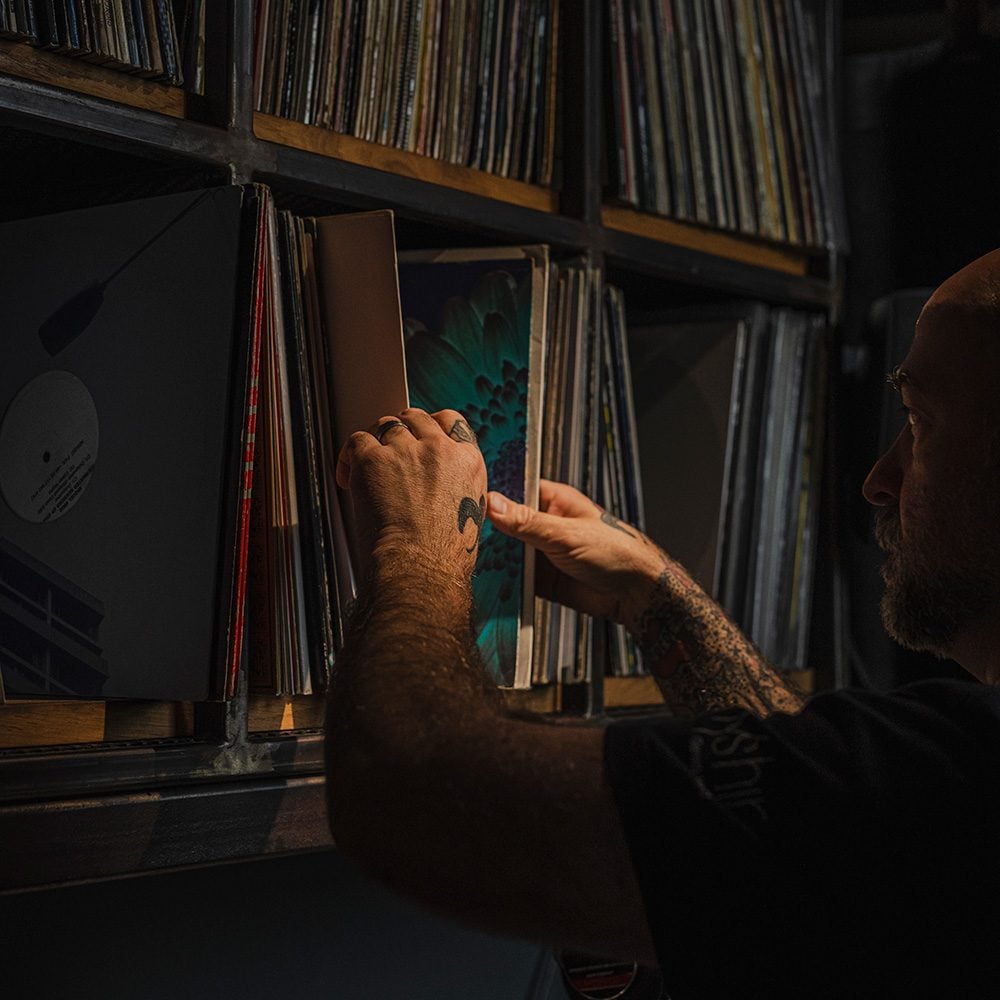 A man selecting records from a shelf