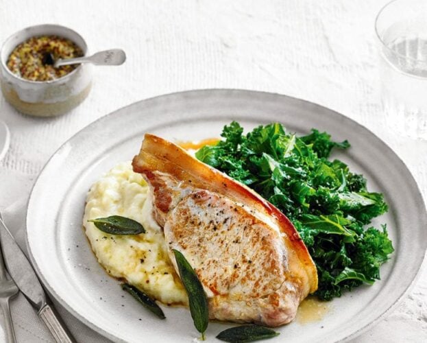 A pork chop served with mash