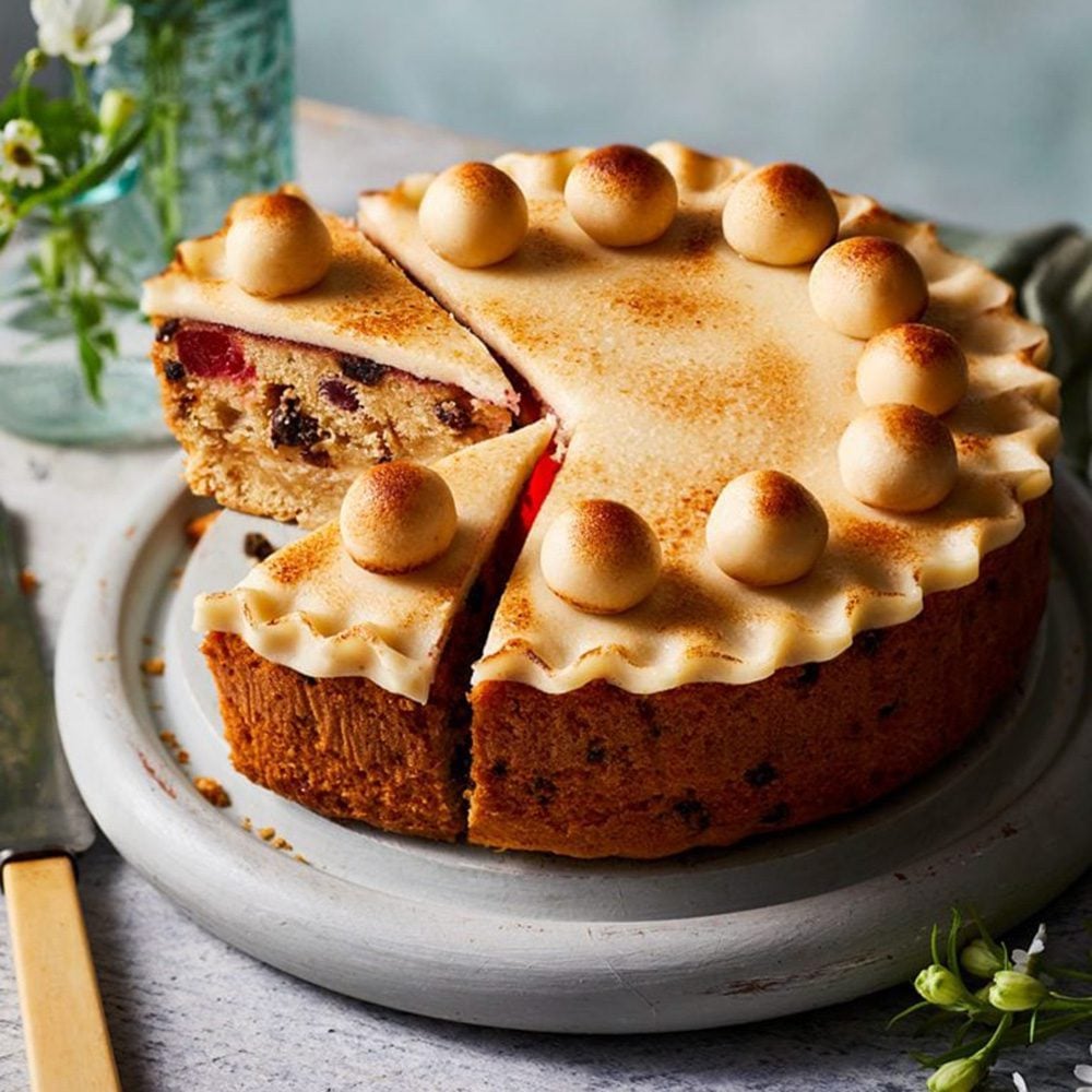 A gluten-free simnel cake with slices taken out