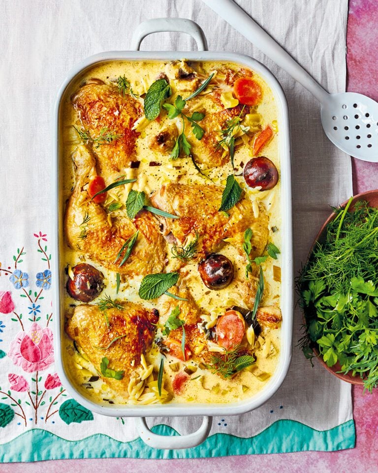 A dish of braised chicken in kefir, topped with herbs