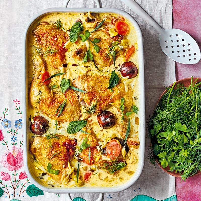 A dish of braised chicken in kefir, topped with herbs