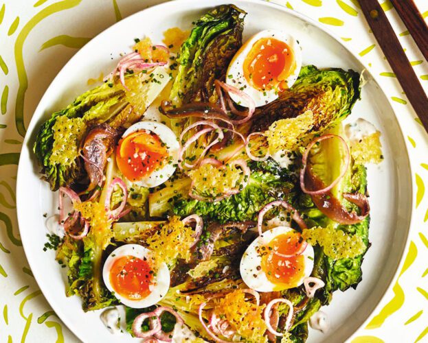 Charred lettuce with boiled eggs, anchovies and parmesan crisps
