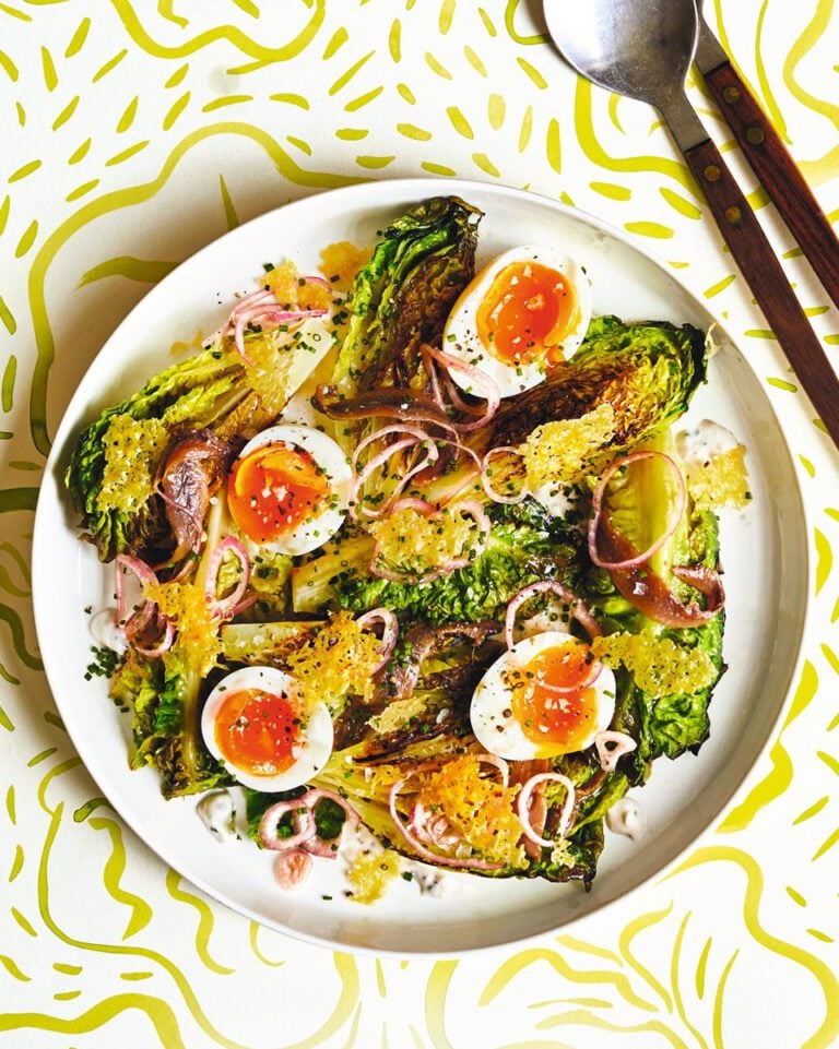 Charred lettuce with boiled eggs, anchovies and parmesan crisps
