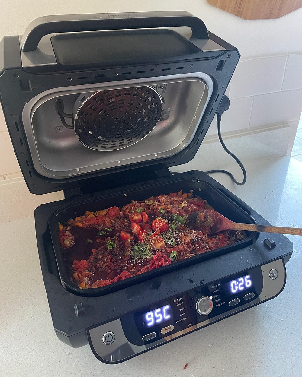 The ProCook air fryer health grill with a stew cooking inside