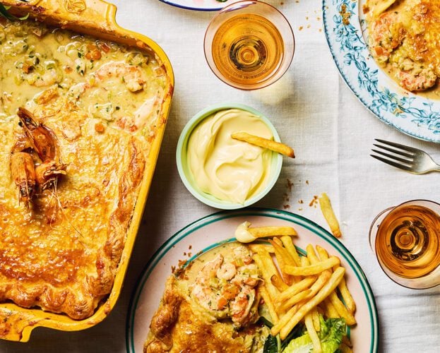 Crab and prawn pot pies with chips and salad
