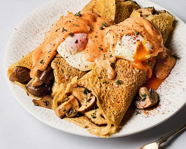 Mushroom buckwheat pancakes with poached egg and paprika hollandaise