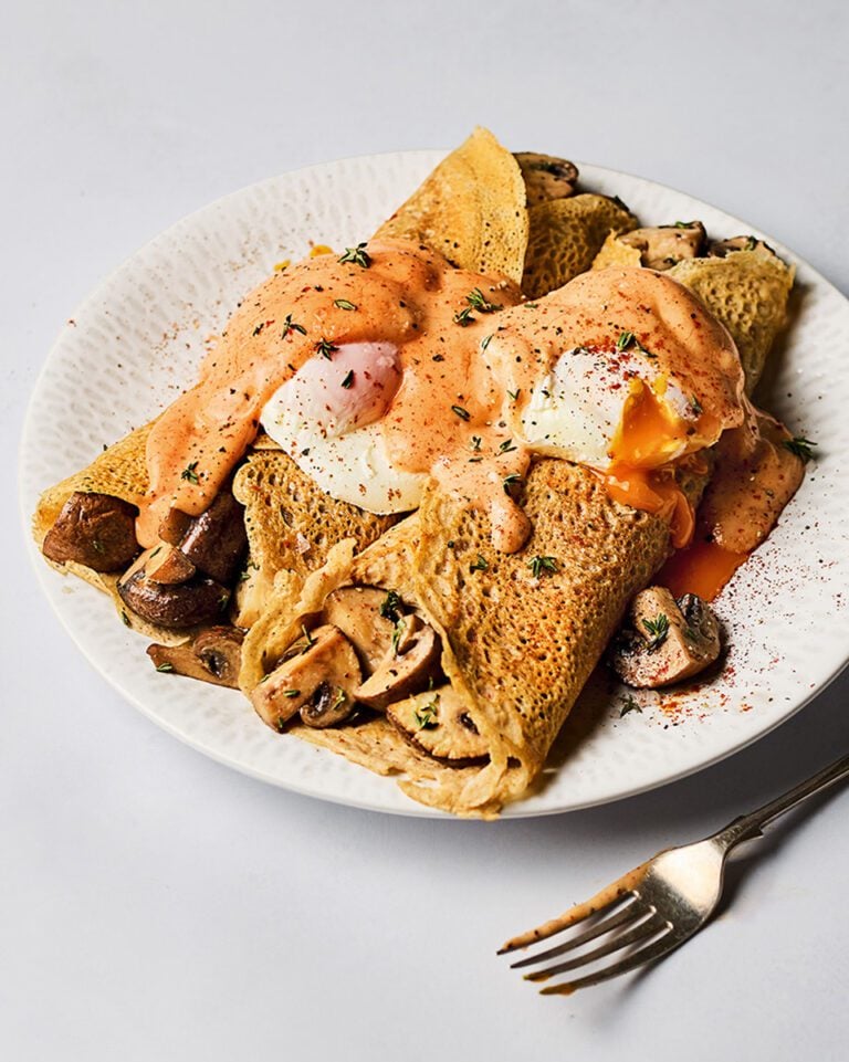 Mushroom buckwheat pancakes with poached egg and paprika hollandaise