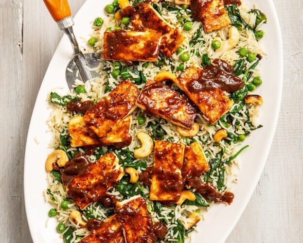 Tomato and mango chutney-glazed paneer on spinach cashew rice