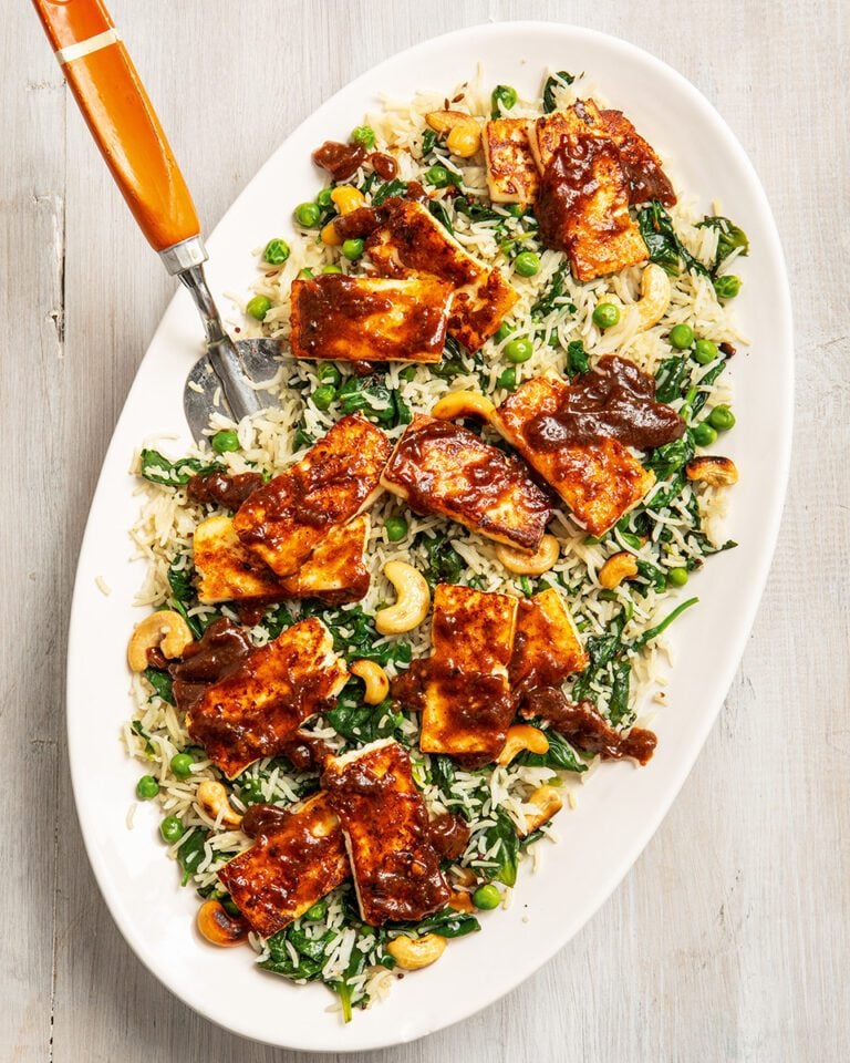 Tomato and mango chutney-glazed paneer on spinach cashew rice