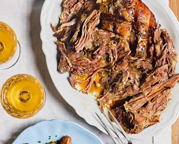 Slow-cooked orange wine lamb shoulder with shallots