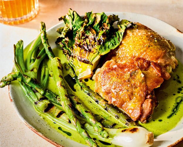 Cider-braised chicken thighs with spring greens