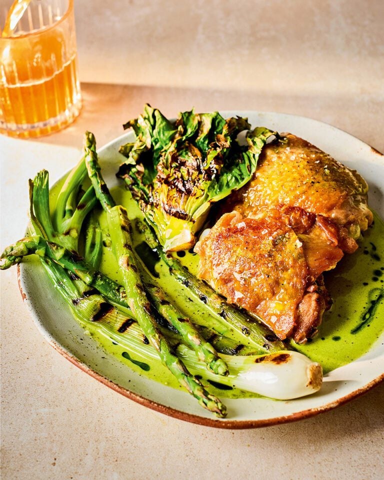 Cider-braised chicken thighs with spring greens